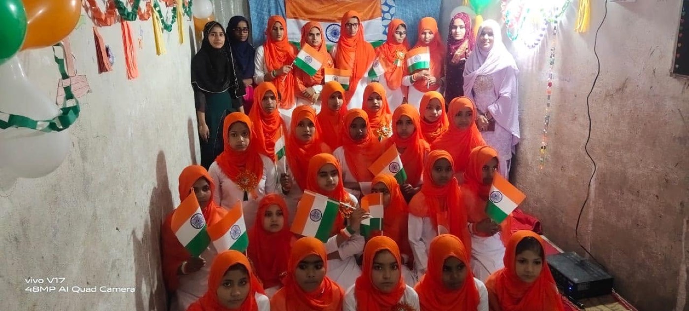 Students and teachers of the trust's school celebrating Independence Day with Indian flags