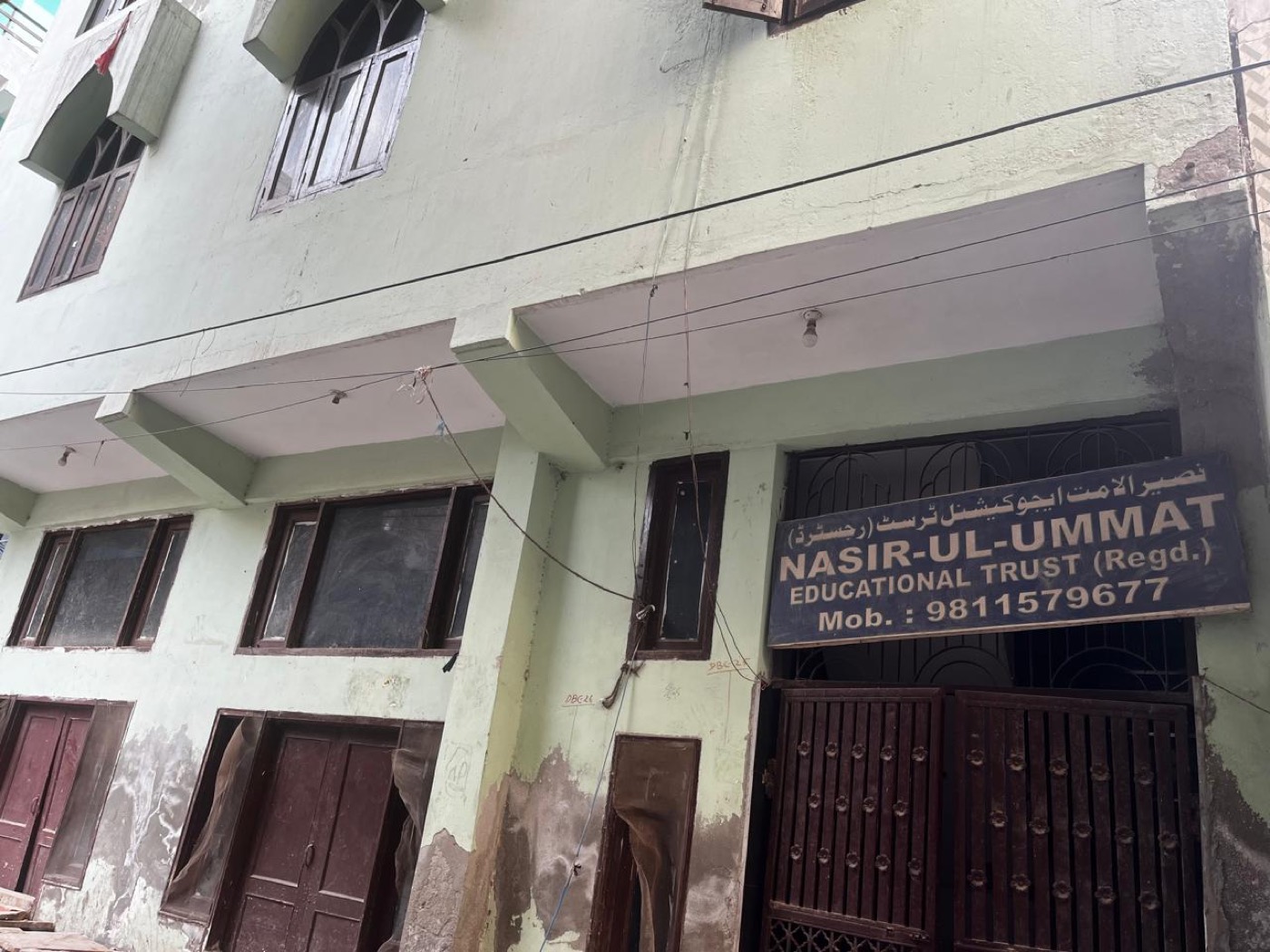 The Nasir-Ul-Ummat Educational Trust building in Kirari Suleman Nagar, Delhi, with its signboard